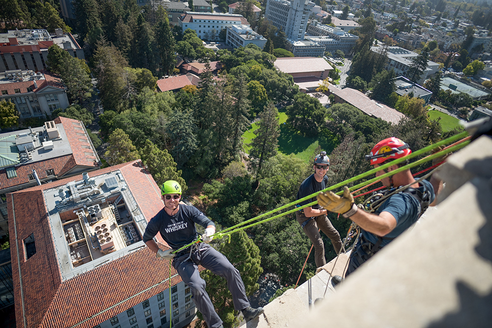 three males dangle over UC Berkeley campus by ropes